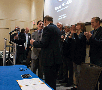 A handshake at the signing ceremony